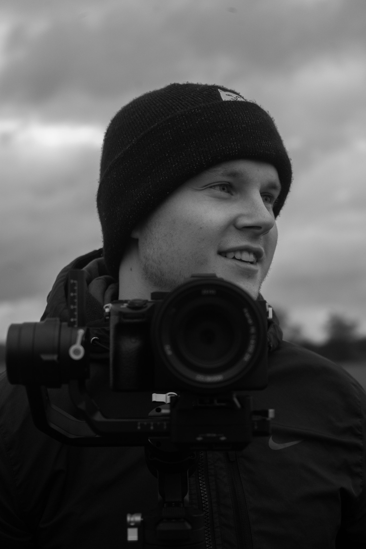 Luke Harris, freelance filmmaker, holding a gimbal-mounted camera